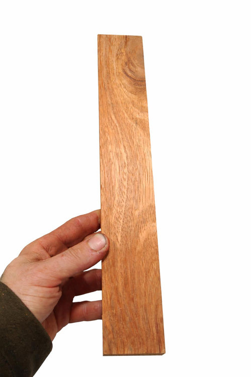Exotic wood blank with warm orange, honey and copper longitudinal grain