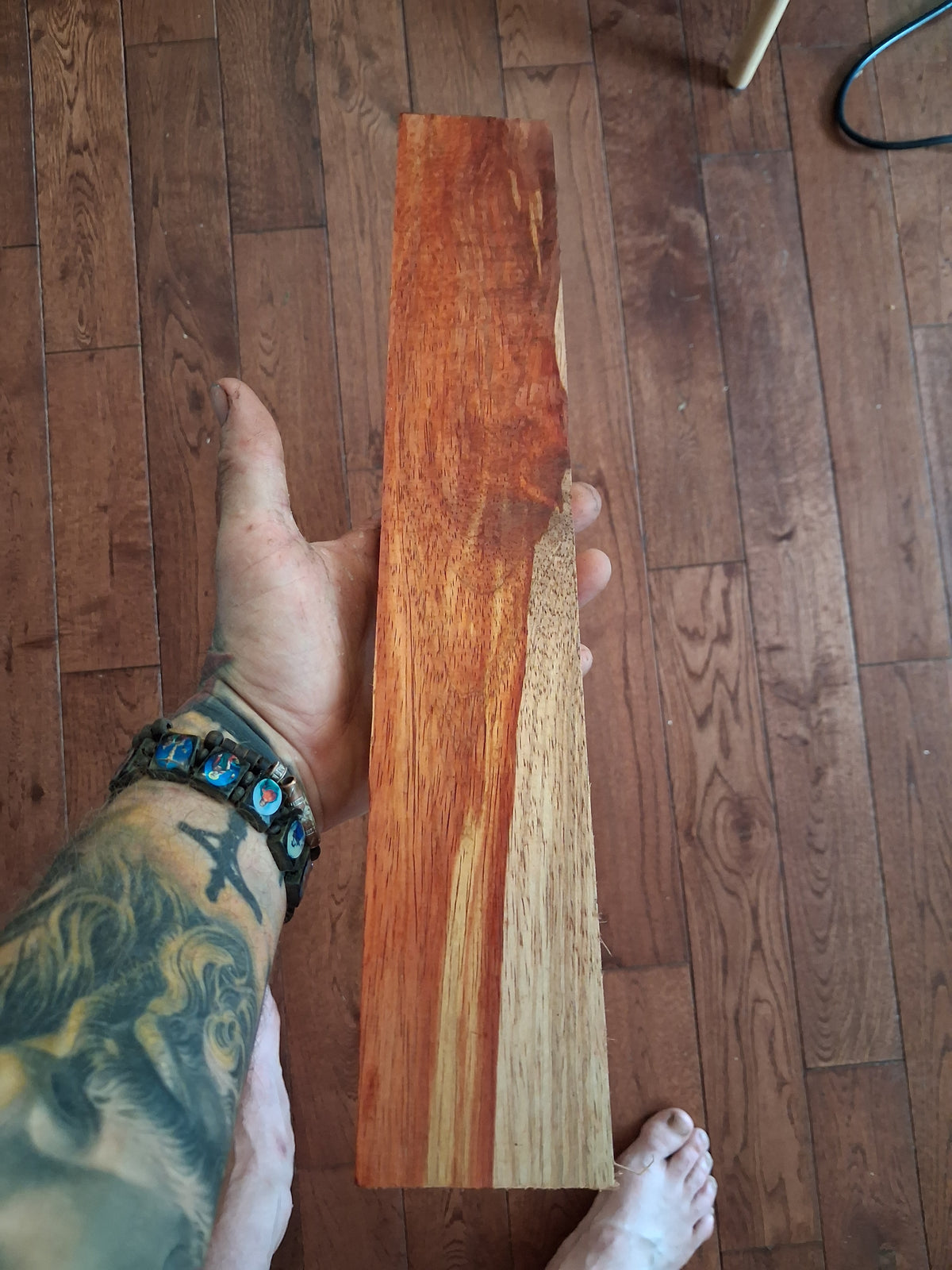Dense Padouk blank with fiery red-orange grain and pale contrast