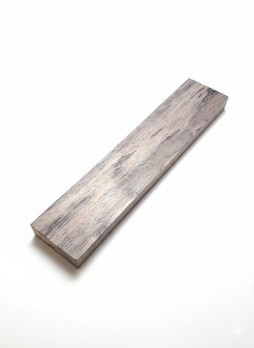 Long violet-toned exotic wood blank with muted mauve organic grain