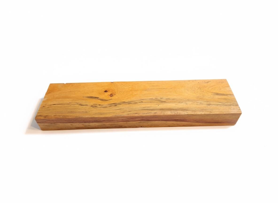 Golden-orange Canarywood handle blank with dark contrasting grain
