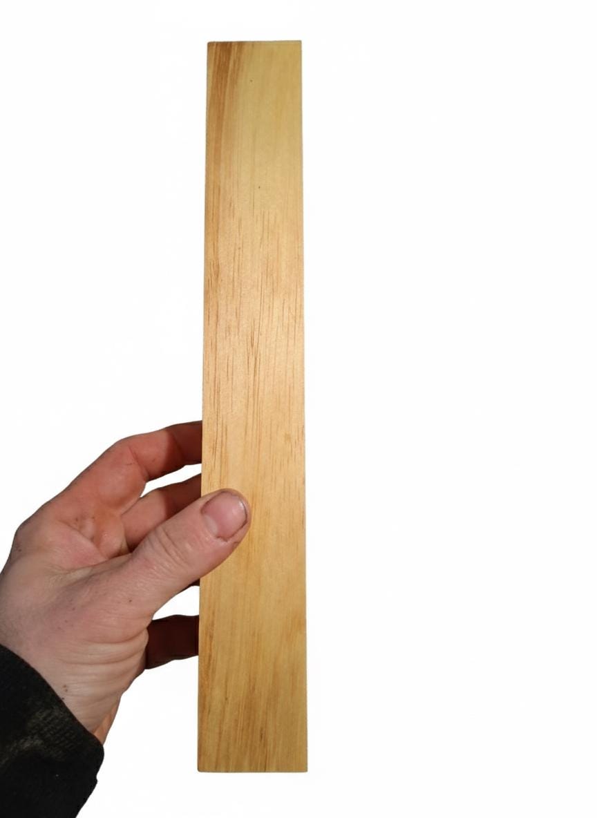 Exotic wood blank with yellow and amber color and subtle dark streaks