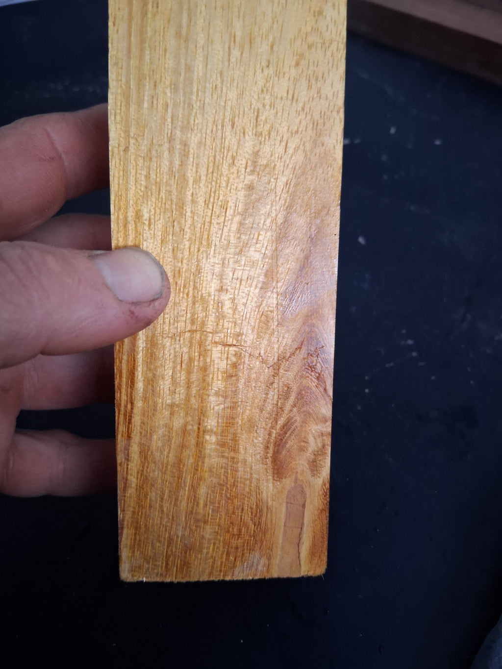 Dense golden hardwood blank with flowing grain and natural eye figure