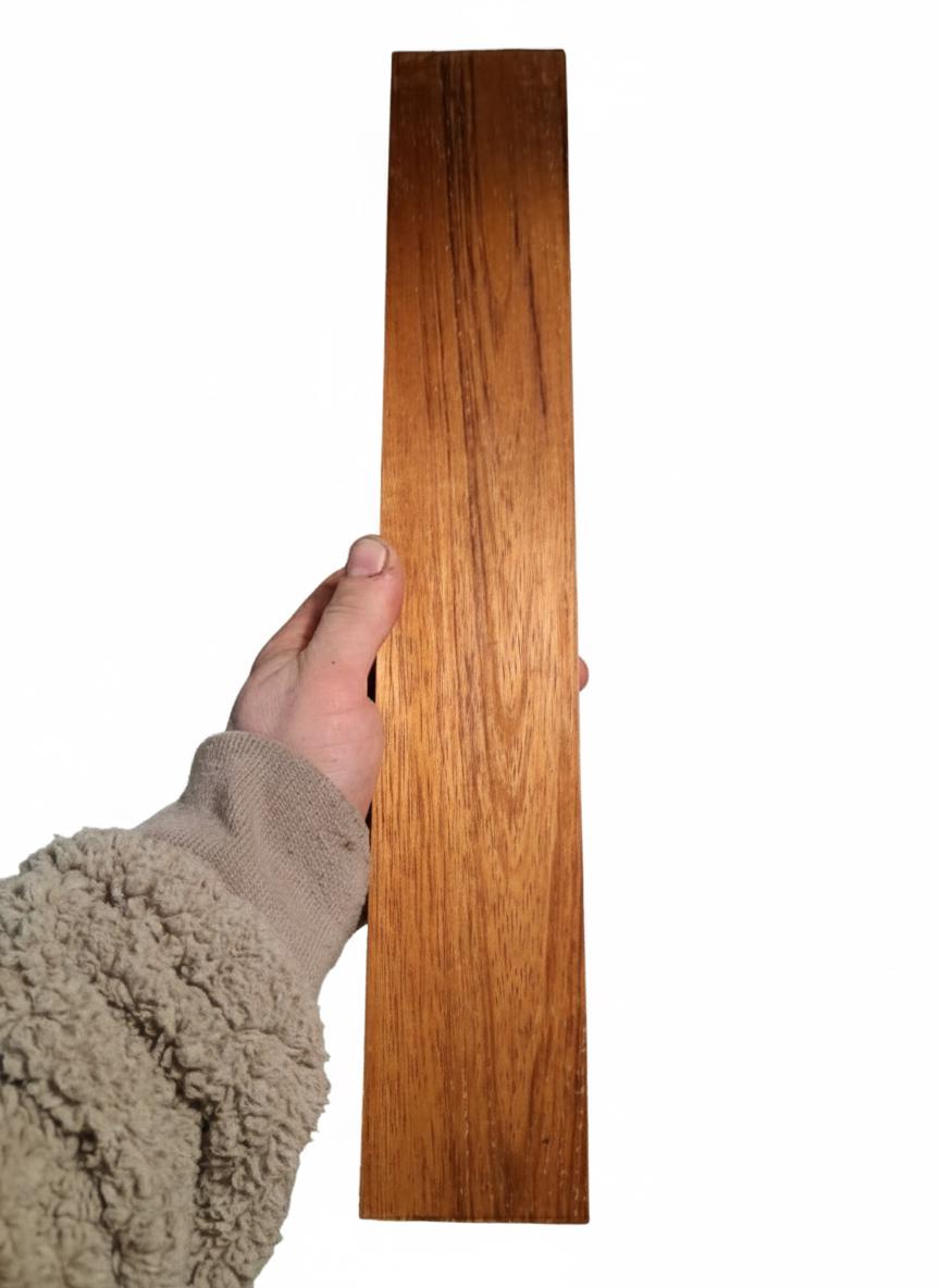 Exotic hardwood blank with flowing dark lines and warm amber-brown color