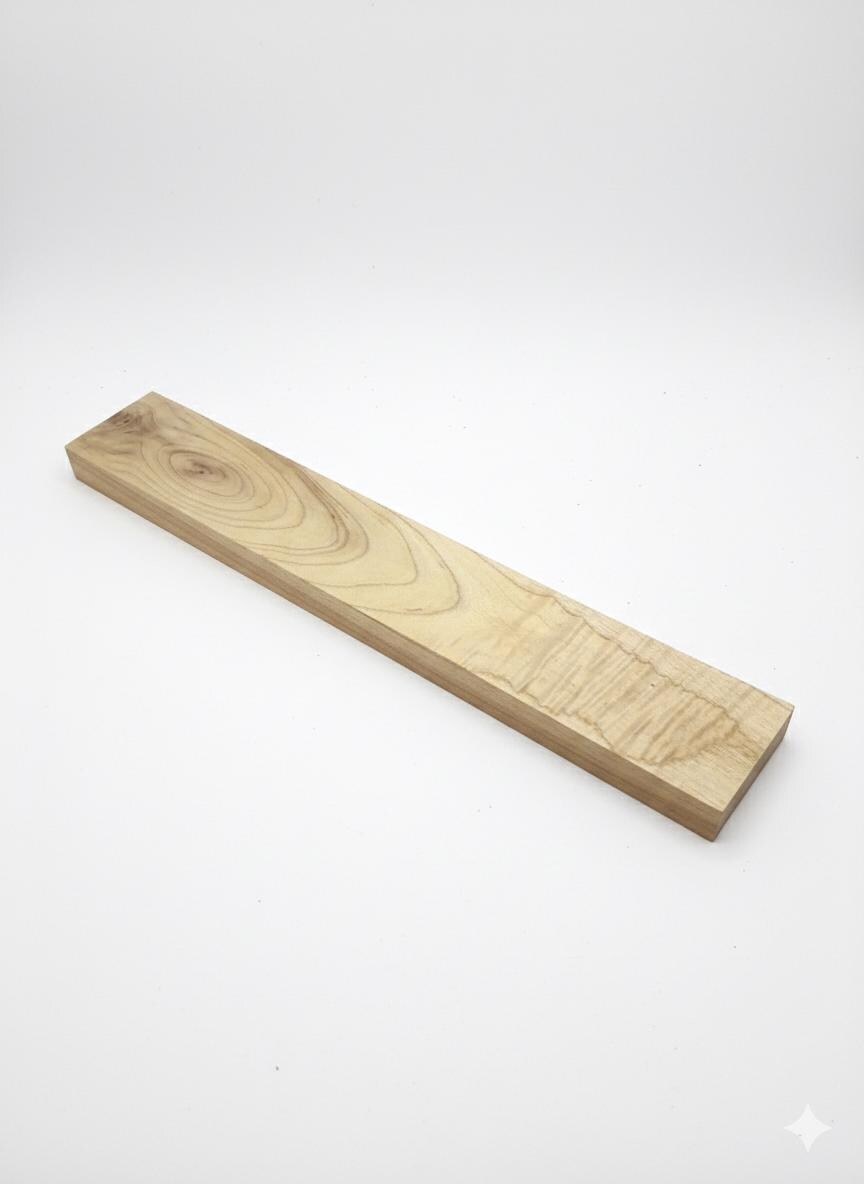 Figured exotic wood blank with ribbon chatoyance and honey-brown contrast