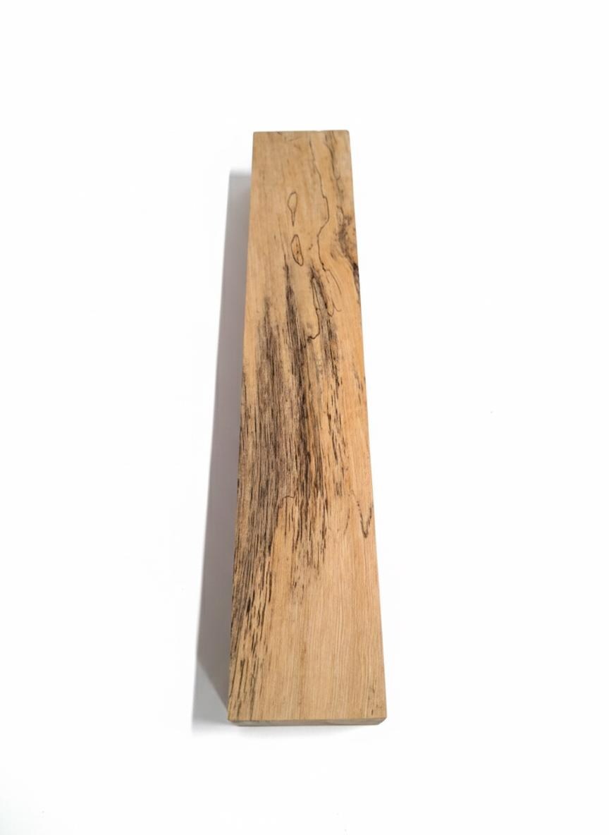 Canarywood exotic blank with honey-gold color and dark spalting lines