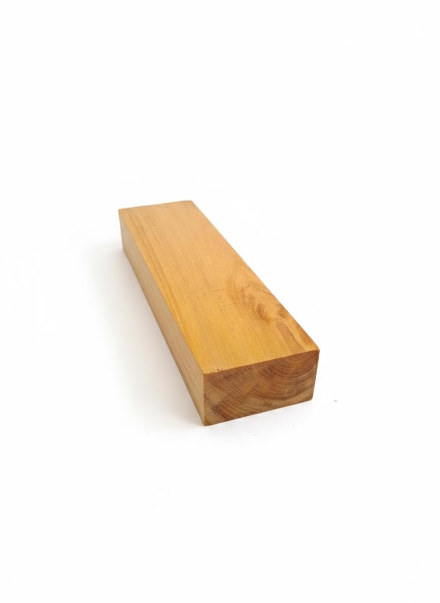 Golden exotic wood blank showing honey grain and warm reflections