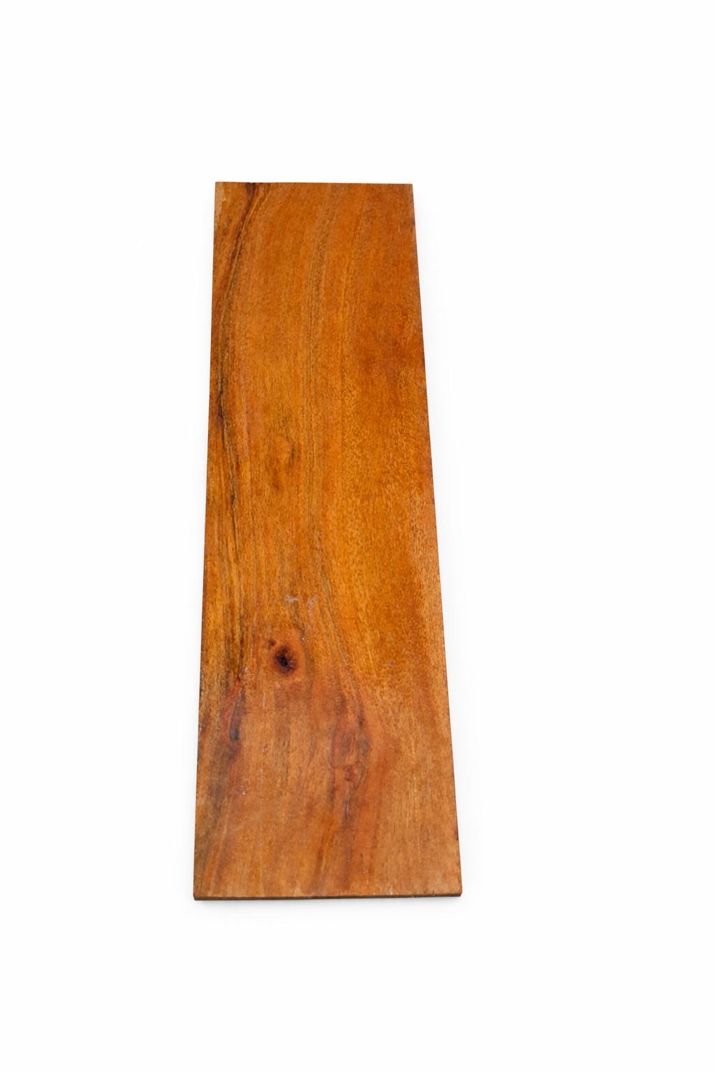 African Walnut turning blank with golden-brown grain and natural live knot