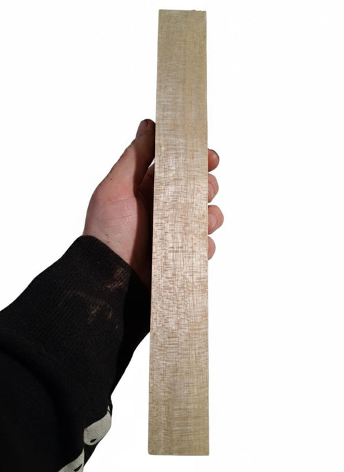 Light golden wood blank with silky grain and green-toned variation