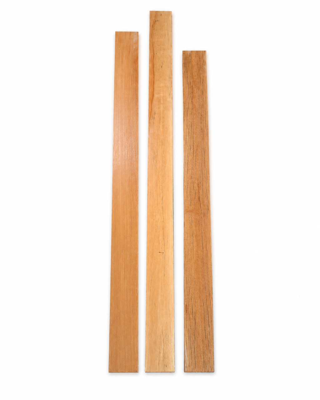 Lot #49, three long exotic hardwood boards with honey-golden tones